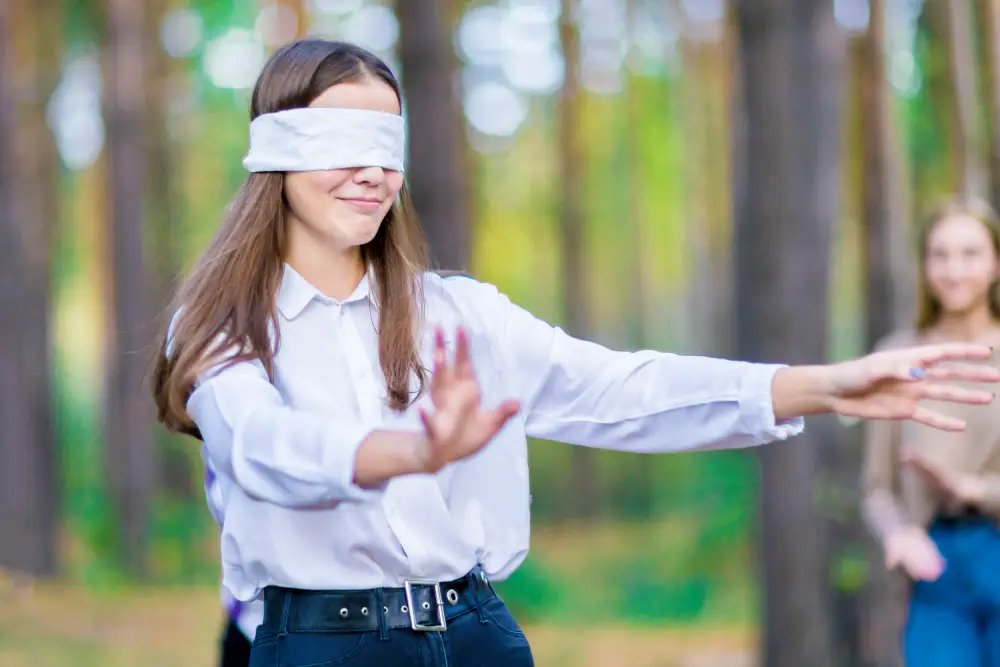 Mother blindfolded trust walk.